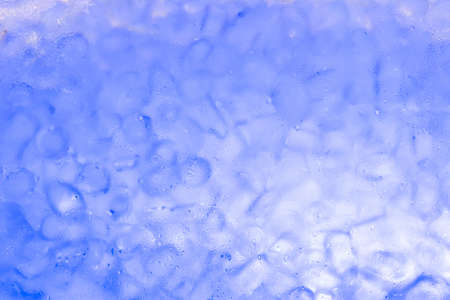 Water drops on glass containers And blur ice cubes are the backdrop.