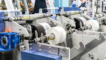 raw material plastic roll set on support unit shaft for supply or feed to modern automatic blow or...