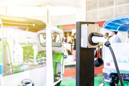 Modern and high technology of transportation electric vehicle charging (Ev) station with plug of...
