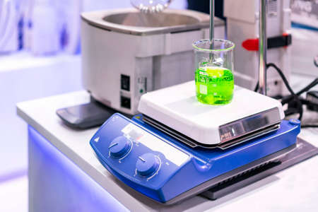 automatic stir or magnetic stirrer vortex mixer and heating device of lab for solution liquid in beaker or vials circular motion for industrial chemical medicine food and beverage cosmetics etcの写真素材