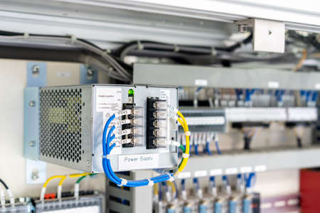 Modern electric AC DC power supply unit in box or cabinet for industrial production line or machine