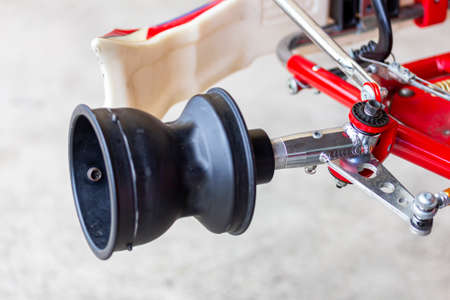 front wheel spindle axle and bracket or hubs of mini racing car sports go kart or scooter during...