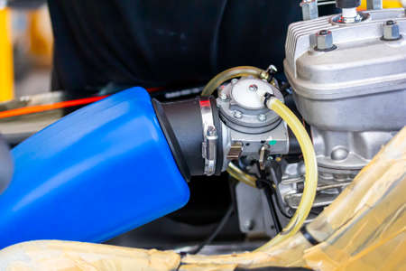 Close up carburetor assembly with body and cylinder head engine of mini racing car sport go kartの写真素材