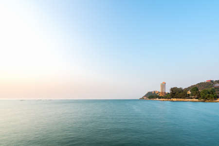 promontory at the sea and beautiful blue sky with sunshine in thailand at evening with copy space (long exposure)の写真素材