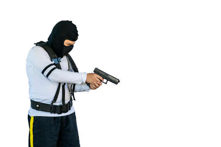 Portrait asian boy wearing a robber hat and individual harness suspenders belt or military Y shoulder strap play acting culprit or outlaw self defend by aim model gun isolatedの写真素材