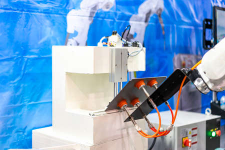 high technology and precision robot arm and automatic vacuum or suction cup for pick & place transportation metal sheet plate or material goods or product of manufacturing process in industrialの写真素材