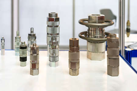 Many type and different metal multi quick coupling connector or high pressure hose fitting device for pneumatic hydraulic system or air fluid transfer of various industrial on tableの写真素材