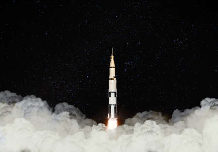 3d image illustration black and white multistage space rocket model flies pass cloud to exploration universe at high speed in the galaxy.の写真素材
