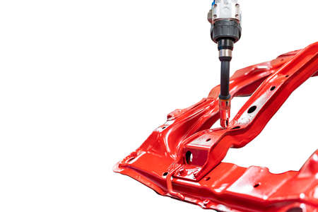 electrode gun holder or mig welding torch and tip simulated path of weld by robot for assembly body frame automobile part in manufacturing process isolated on white with clipping pathの写真素材
