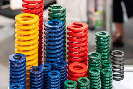 various size and kind of metal coil spring for stamping die or injection mold such as red green blue green color for industrialの写真素材