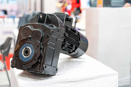 close up reducer gearbox and electric motor for manufacturing machine on table