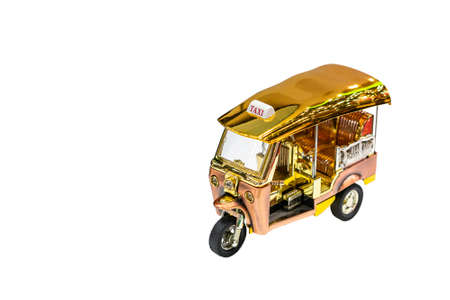 golden and silver shiny color passenger 3 wheel car model or toy call tuk tuk taxi in bangkok of...