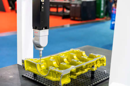 automatic coordinate measurement machine (CMM) during inspection automotive or motorcycle industrial part in quality control manufacturing processの写真素材
