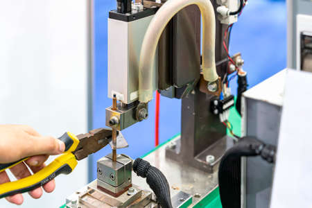 Close up metal metal sheet or work piece during working by resistance spot welding manufacturing processの写真素材