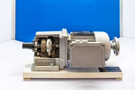 cross section show metal helical gear or cogs gear bearing housing shaft and detail inside of transmissions gearbox for industrial assembly with electric induction motorの写真素材