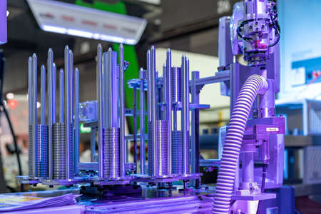 Steel ring or metal workpiece arranged in vertical rows for move to deburring station process by accuracy automation system robot armの写真素材