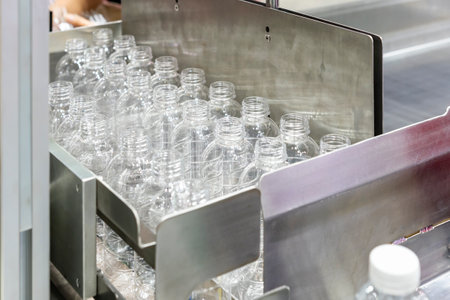 many clear plastic pet empty bottle after manufacturing process for fill water or beverage in...