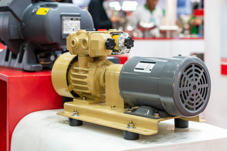 electric motor with rotary vane dry vacuum pump and suction filter for industrial on tableの写真素材