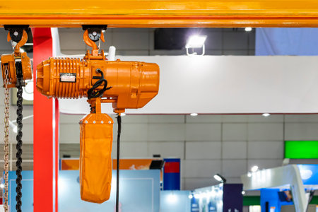 Manual chain hoist and overhead electric chain hoist install at mono rail runway beamの写真素材