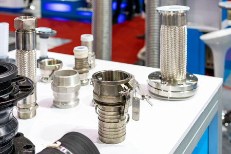 metal quick fitting or hose shank adapter coupling and other parts such as flexible connector tube in industrial on tableの写真素材