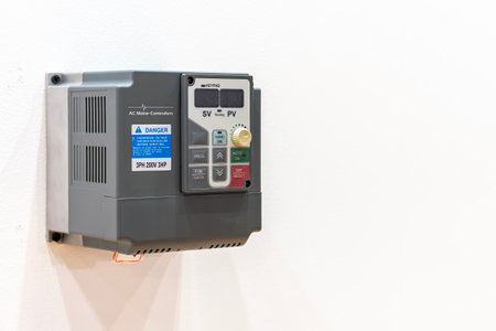 ac motor controller for control speed (rpm) by frequency voltage supply to motor on board with copy spaceの写真素材