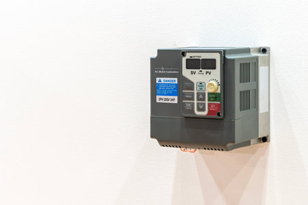 ac motor controller for control speed (rpm) by frequency voltage supply to motor on board with copy spaceの写真素材
