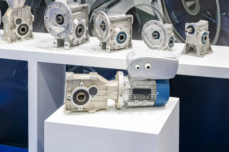 reducer gearbox assembly with electric motor for manufacturing machine on table with difference size...