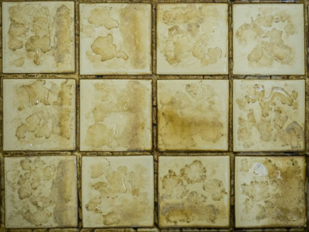 Close up of bathroom floor tile texture with water stain spot.の写真素材