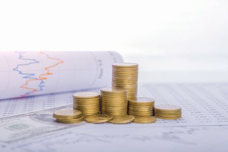 The tree is growing both on the progress of money and financial reports, along with financial accounts, business, investment on the investor's table. Front investment conceptの写真素材