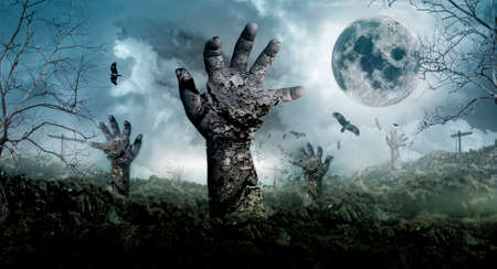 The concept of Halloween with zombies rising from the graveyard.