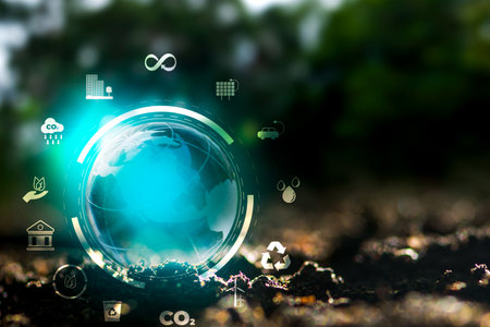 Renewable energy concept Earth Day or environment protection Hands protect forests that grow on the ground and help save the world.の写真素材