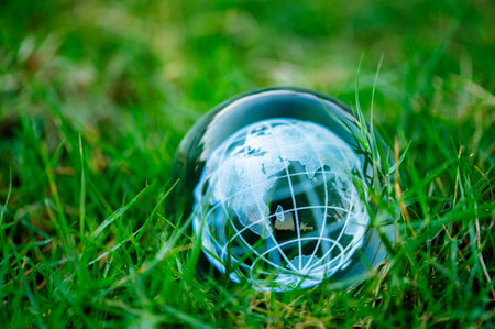 Renewable energy concept Earth Day or environment protection Hands protect forests that grow on the...