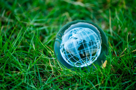 Renewable energy concept Earth Day or environment protection Hands protect forests that grow on the...