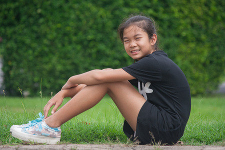 Shoot portrait of Asian children in public park outdoor.の写真素材