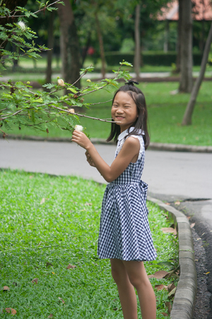Shoot portrait of Asian children in public park outdoor.の写真素材