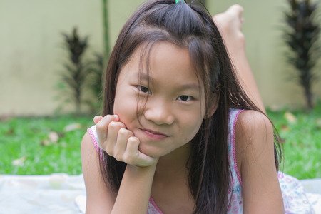 Shoot girl and children portrait in garden.の写真素材