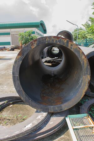 Iron scrap of metal pipeline in factory.