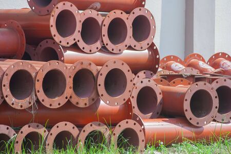 Stack of new metal pipeline in factory.の写真素材