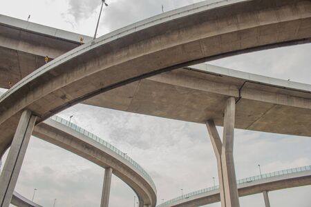 Bhumibol Bridge or Bridge of Industrial Rings is concrete highway overpass and cross the Chao Phraya River, Thailand. Foreign text on the bridge is the name "Bhumibol 1 and 2".の写真素材
