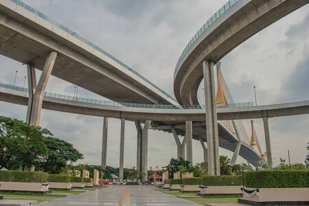 Bhumibol Bridge or Bridge of Industrial Rings is concrete highway overpass and cross the Chao Phraya River, Thailand. Foreign text on the bridge is the name "Bhumibol 1 and 2".の写真素材
