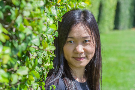 Shoot Asian woman portrait in lifestyle at public park, Bangkok, Thailand.の写真素材