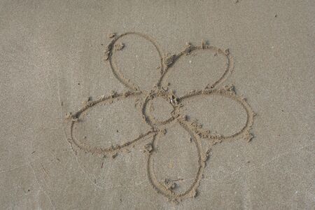 Flower image on sand of beach that make from shell.の写真素材