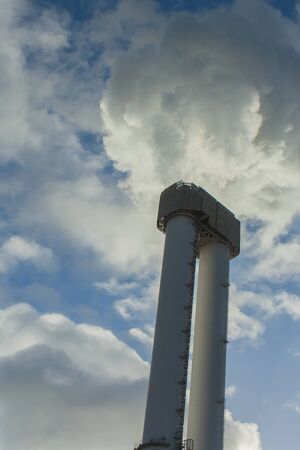 Chimney release smoke from factory.
