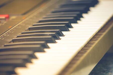 Close up piano or electone keyboard in Autumn filter effect.の写真素材