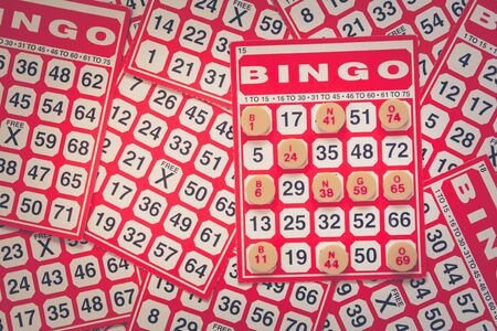 Business Success and Challenge Concept : Bingo card on white tile background. (Autumn filter effect)の写真素材