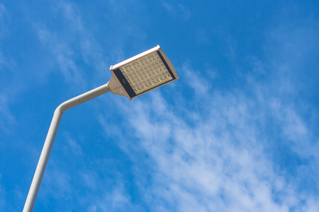 Uprisen view of street lamp on walkway with blue sky.の写真素材