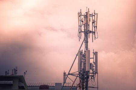 Television antenna with sunlight background in cloudy day.の写真素材