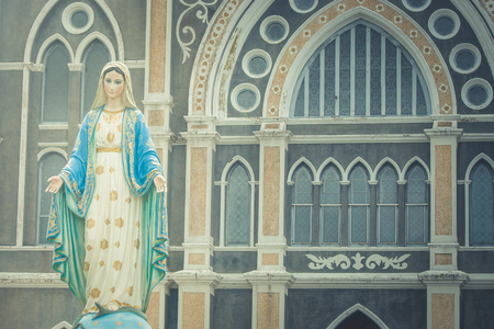 The Blessed Virgin Mary statue standing in front of The Roman Catholic Diocese that is public place in Chanthaburi Province, Thailand.の写真素材