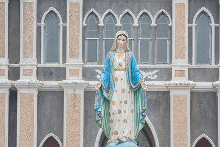 The Blessed Virgin Mary statue standing in front of The Roman Catholic Diocese that is public place in Chanthaburi Province, Thailand.の写真素材