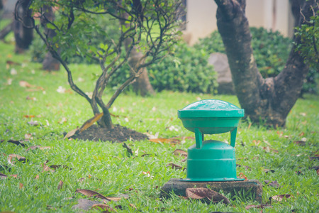 Green garden lamp for outdoor on green grass in public park.の写真素材